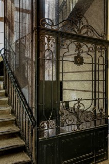 Ornate door from a historic lift in an old factory