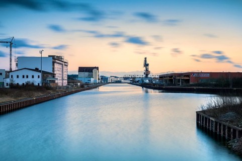 Long exposure at the canal in Hannover district Linden with view to the harbour at sunset
