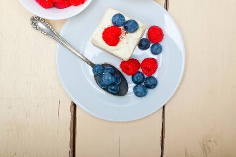 Fresh homemade raspberry and blueberry cream cake