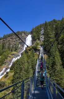 Hiking trail over a suspension bridge along the Stuibenfall near Umhausen