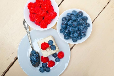 Fresh homemade raspberry and blueberry cream cake