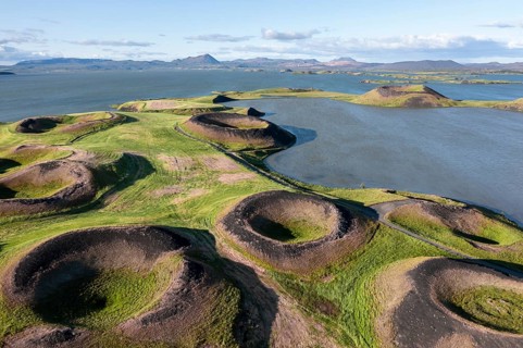 Aerial view of green volcanic crater