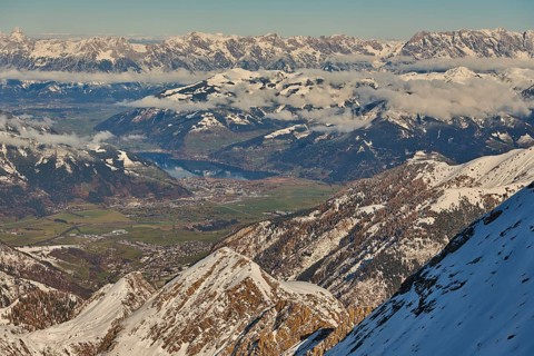 View from Mount Kitzsteinhorn on snow covered mountains down to Zell am See