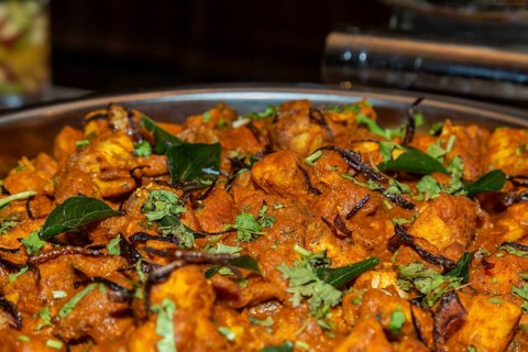 Traditional fish curry in spicy curry powder with thick gravy