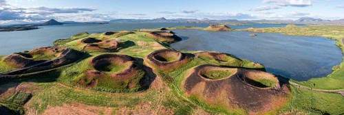 Aerial view of green volcanic crater