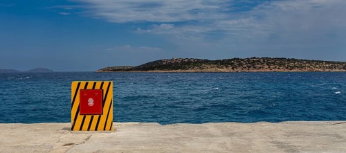 Yellow container for the fire hose at the harbour basin