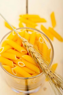 Short Italian pasta penne with durum wheat grains
