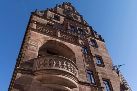 Gothic tracery of the balcony parapets of the historic Hotel Deutscher Kaiser
