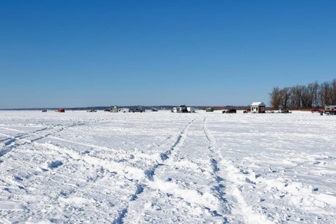 Tire tracks in snow on a frozen river