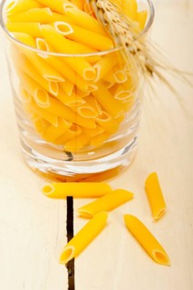 Short Italian pasta penne with durum wheat grains
