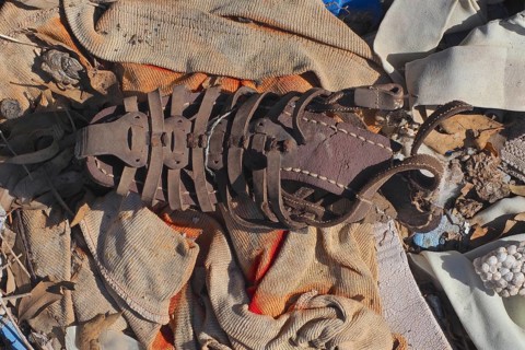 Fragment of leather sandal