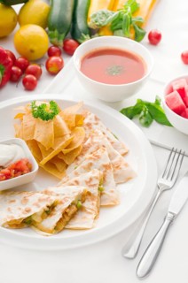 Original Mexican quesadilla de pollo with nachos served with gazpacho soup and watermelon