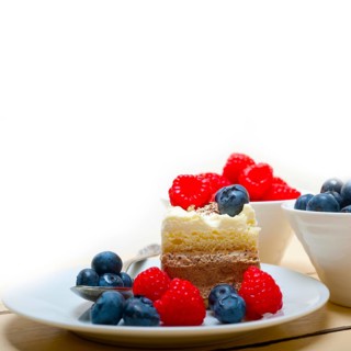 Fresh homemade raspberry and blueberry cream cake