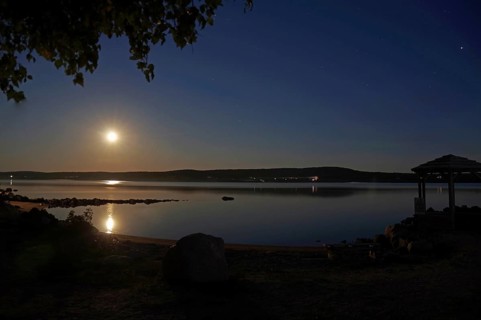 Full moon over a body of water