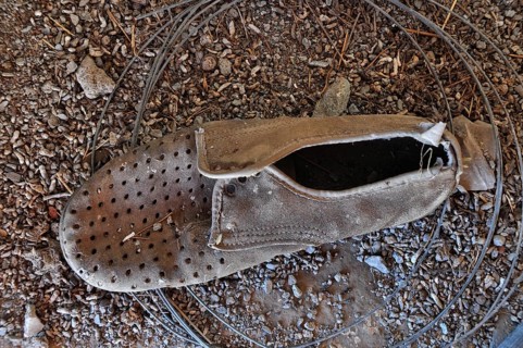 Miserable suede men's shoe on the floor