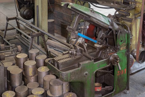 Iron saw for cutting dies in a former valve factory