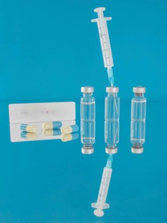 Vaccine bottles and syringe