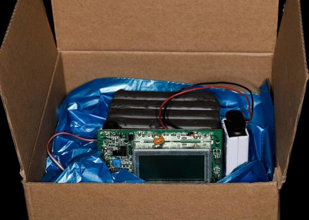 Plastic explosive with timer and battery lies in a box