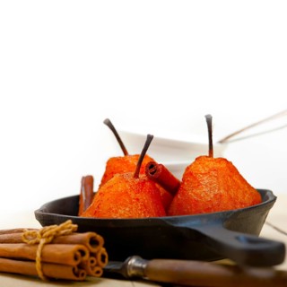 Poached pears delicious home made recipe ove white rustic wood table
