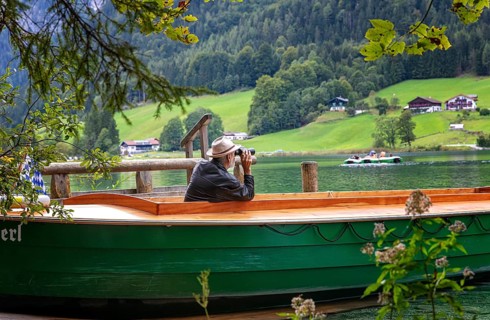 Ferryman of the Annerl ferry station at Hintersee keeps an eye out for passengers