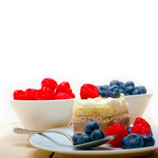 Fresh homemade raspberry and blueberry cream cake