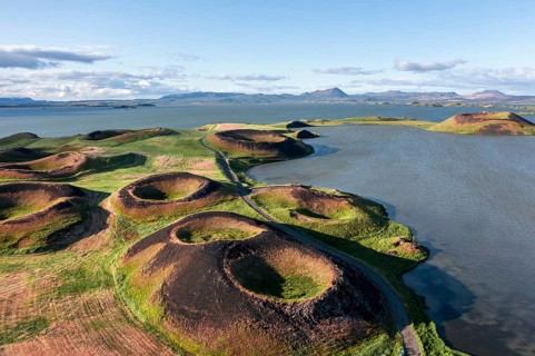 Aerial view of green volcanic crater