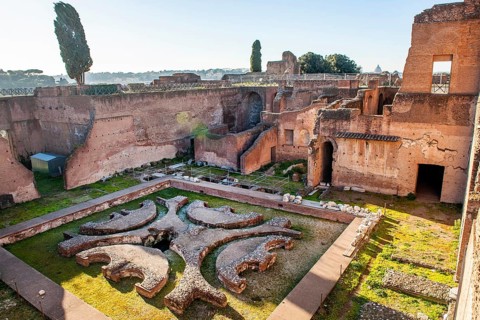 Ruin remains of ancient Pelta fountain in sunken peristyle former portico in former imperial palace Domus Augustana