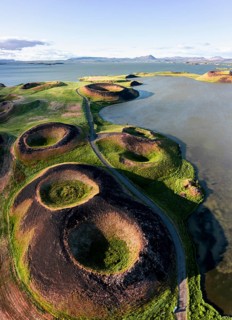 Aerial view of green volcanic crater