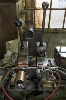 Detailed view of a welding machine in a former valve factory