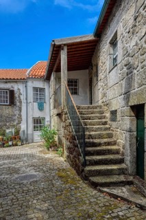 Narrow cobble street and old stone houses