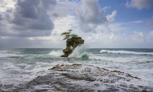 Waves crashing against rocks in the sea