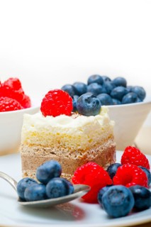 Fresh homemade raspberry and blueberry cream cake