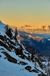 View from Mount Kitzsteinhorn on snow covered mountains down to Zell am See