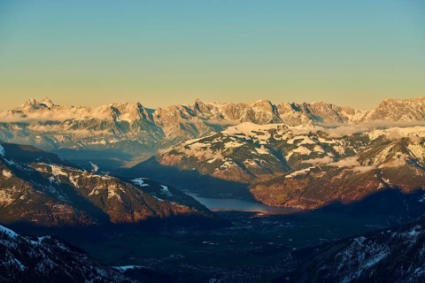 View from Mount Kitzsteinhorn on snow covered mountains down to Zell am See