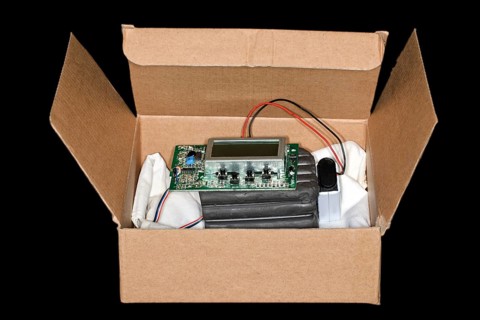 Plastic explosive with timer and battery lies in a box