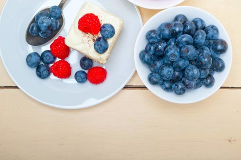Fresh homemade raspberry and blueberry cream cake