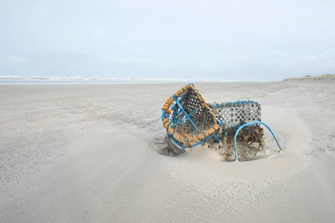 Washed-up fishing baskets on the beach