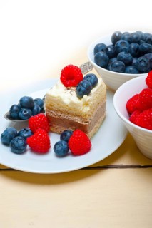 Fresh homemade raspberry and blueberry cream cake