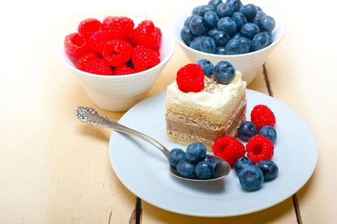 Fresh homemade raspberry and blueberry cream cake