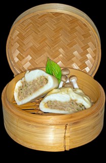 Halved bhan bao stuffed with pork meat and shimeji mushrooms