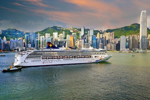 Large cruise ship sails on the Hong Kong River in the early morning