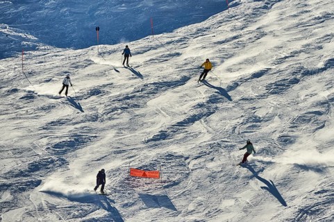 Skiers coming down from the hill