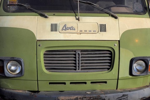 Front view of lime green Avia van