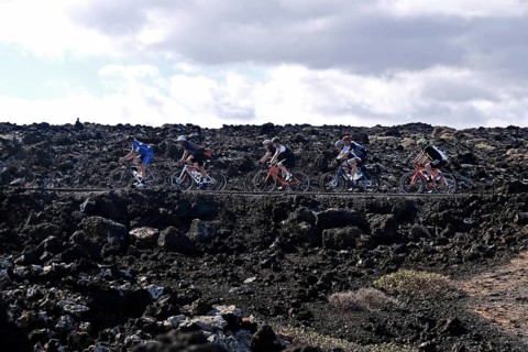 Road cyclist on the coastal road near Orzola