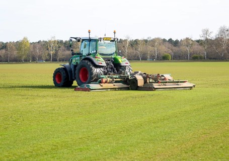Fendt 313 tractor mowing grass
