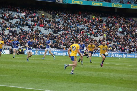 Gaelic football player with ball in hand during match in Dublin