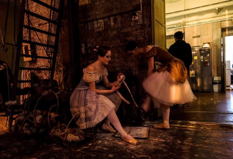 Ballet dancers in the wings preparing themselves to get onstage during the performance of Tchaikovsky s Swan Lake in St. Petersburg