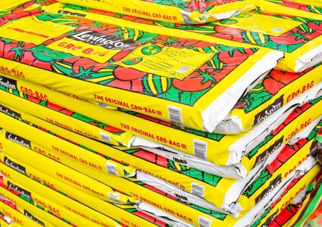 Bags of Levington Gro-Bag tomato planters grow bags stacked up