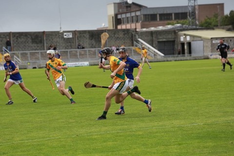 GAA player with hurley and ball during a game as Lixnaw win Kerry county hurling county final