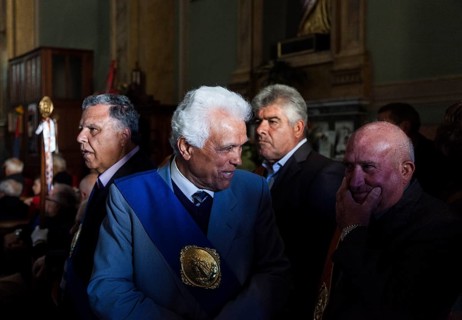 Elderly man in the Cathedral preparing for the celebrations of Easter Sunday in Aidone